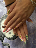 Bape handmade press-on nails in pink, green, and beige/ Faux ongles "press-on" Bape faits main en rose, vert et beige.