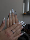 Handmade press-on nail in black and milky white, alternative style